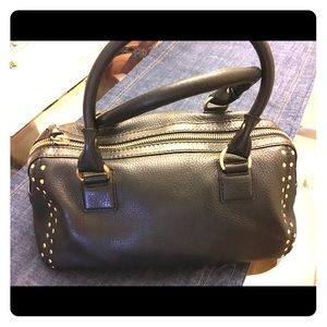 Black MK bowling style bag with gold grommets